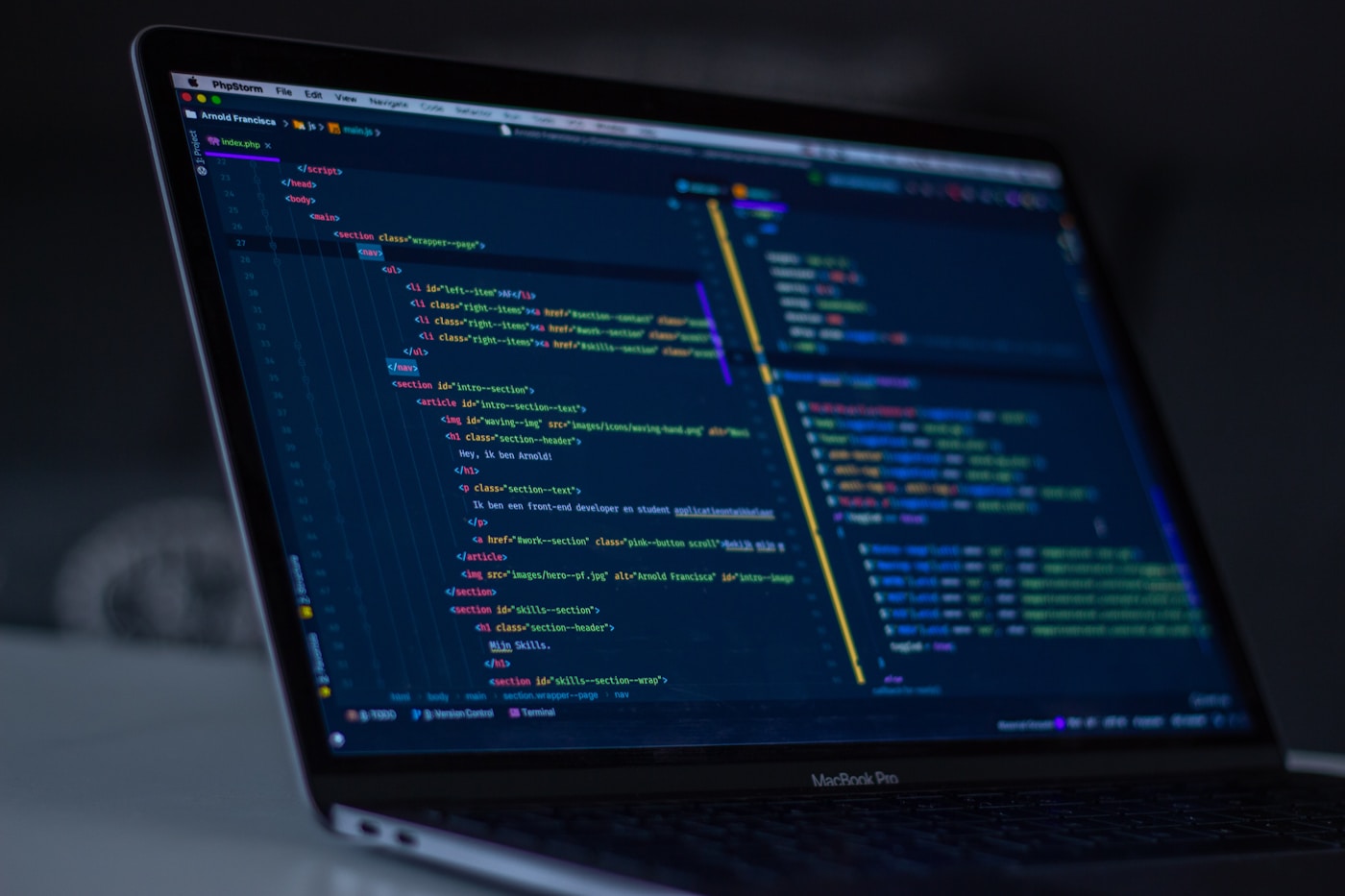 Code on a computer screen comparing development approaches